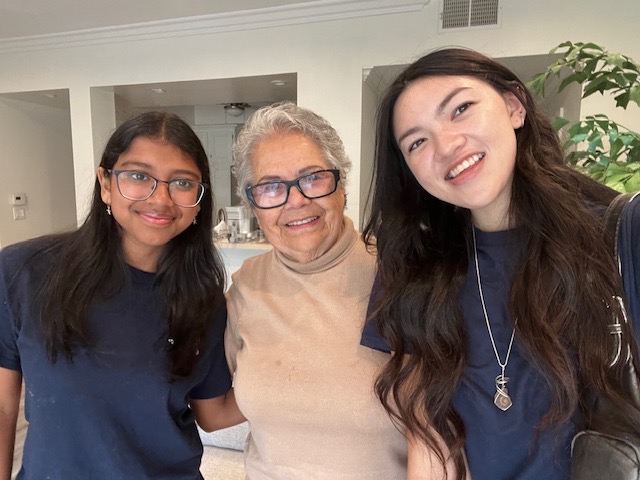 CONNECT students visiting with a Westside Pacific Villages member